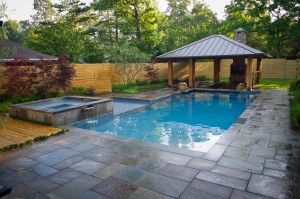 A traditional pool with beautiful stone decking.