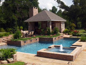 A geometric pool with a fountain.